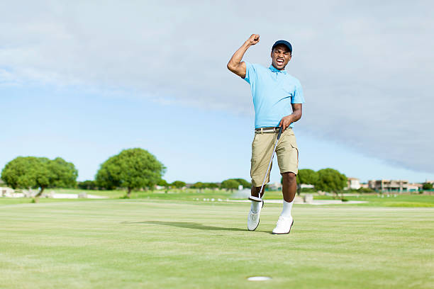 A person playing golf, celebrating